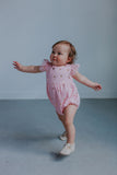 pink and gold bubble rompers