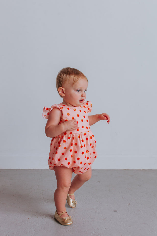 infant girl's orange and peach floral first birthday outfit
