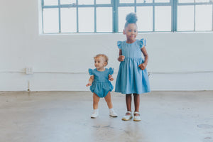 Infant Girl's Denim Chambray Romper with Pom Pom Trim
