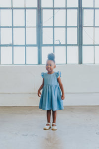 Little Girl’s Chambray Cotton Flutter Sleeve Dress with Keyhole Cut Out and Pom Pom Trim