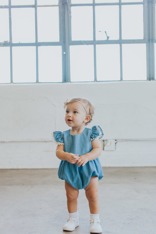 Infant Girl's Denim Chambray Romper with Pom Pom Trim