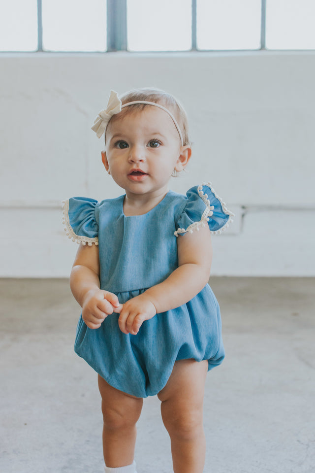 Infant Girl's Denim Chambray Romper with Pom Pom Trim