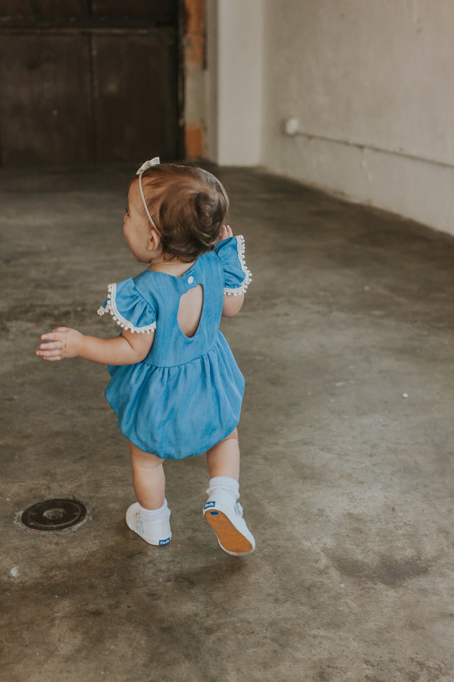 chambray pom pom romper baby