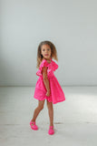 little girls pink polka dot pinafore style dress