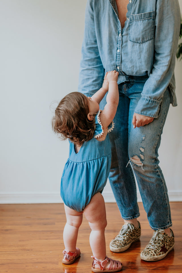 Infant Girl's Denim Chambray Romper with Pom Pom Trim