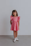 little girl's pink ruffle dress