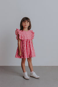 girl's pink and white ruffle dress
