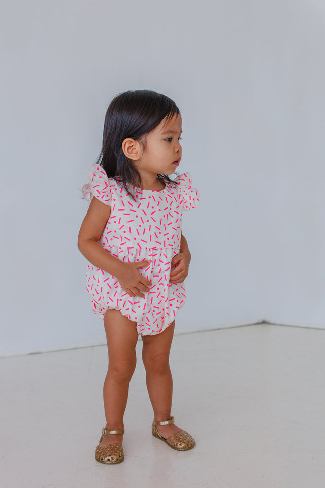 pink confetti bubble romper
