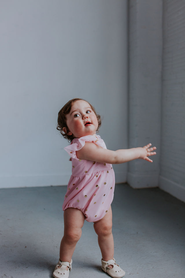pink and gold bubble romper