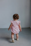 pink and gold baby outfit