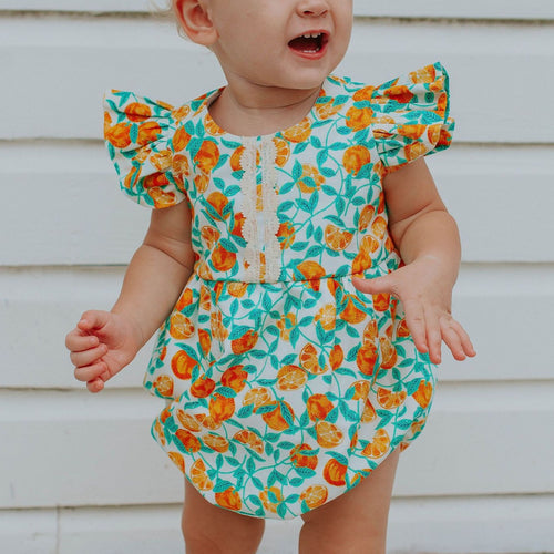 little girls orange print citrus bubble romper