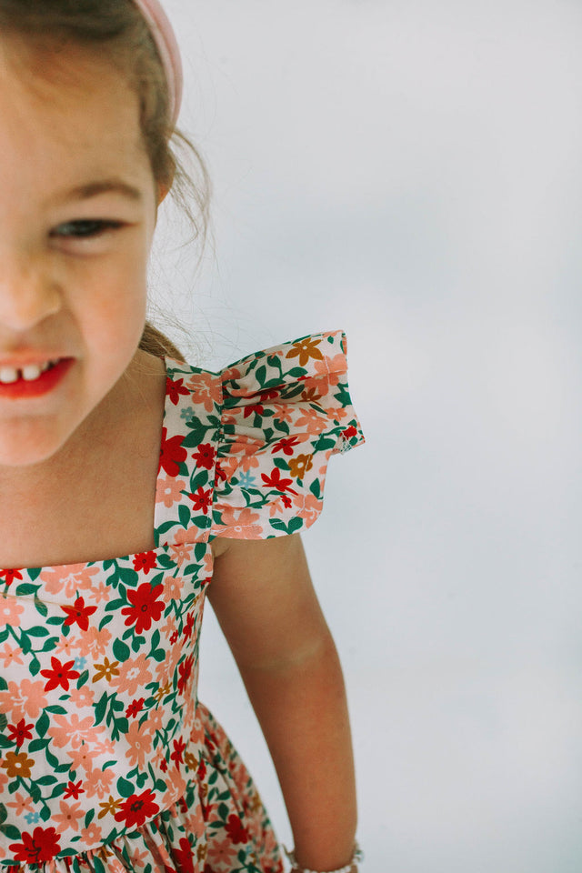little girls pink red and gold floral twirl dress with flutter sleeves