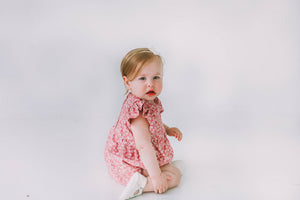 pink and white ditsy floral print romper
