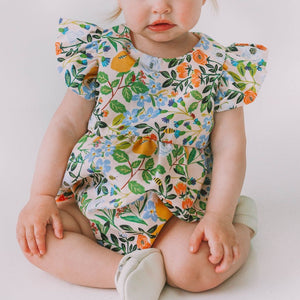 Infant Girl's Orange Blue and Green Botanical Floral Bubble Romper. A gorgeous multicolor floral print outfit for babies, featuring a stunning orange, blue and green print with tiny bees. Matches our orange, blue and green botanical print pinafore twirl dress.