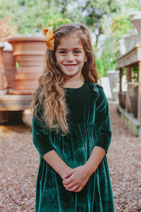 Girls-Holiday-Outfits-in-green-velvet-on-little-girl-model-outside