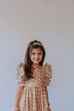little girl's beige orange and gold calico floral pinafore style dress with crochet lace trim