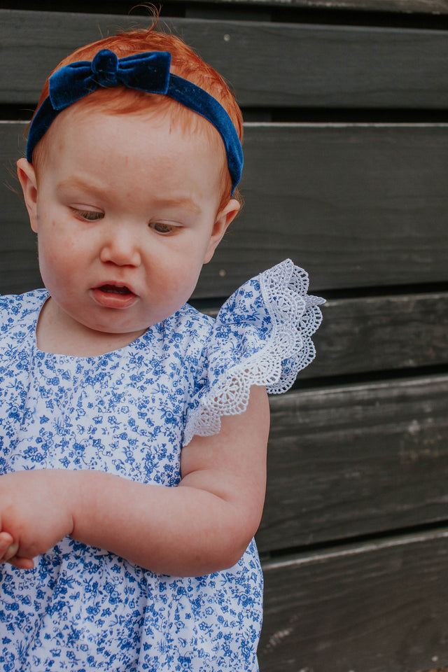 blue and white ditsy calico floral romper