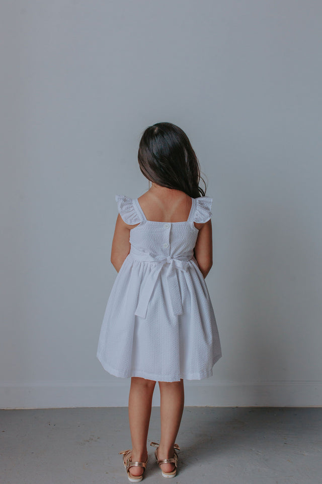 little girl's white seersucker ruffle dress