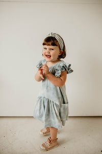little girls blue tie dye dress with flutter sleeves and pockets
