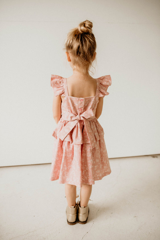 girls pink and white floral twirl dress with peplum skirt