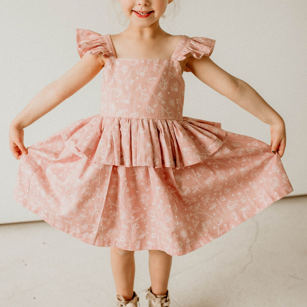 girls pink and white floral twirl dress with peplum skirt