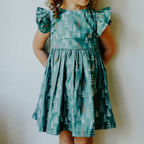 little girls muted hygge tree christmas dress