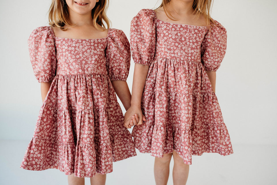 little girls pink and white puff sleeve dress