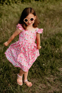 little girls pink roller skate print dress