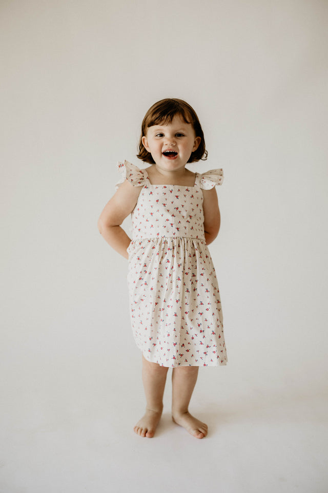 red and white ditsy floral flutter sleeve dress