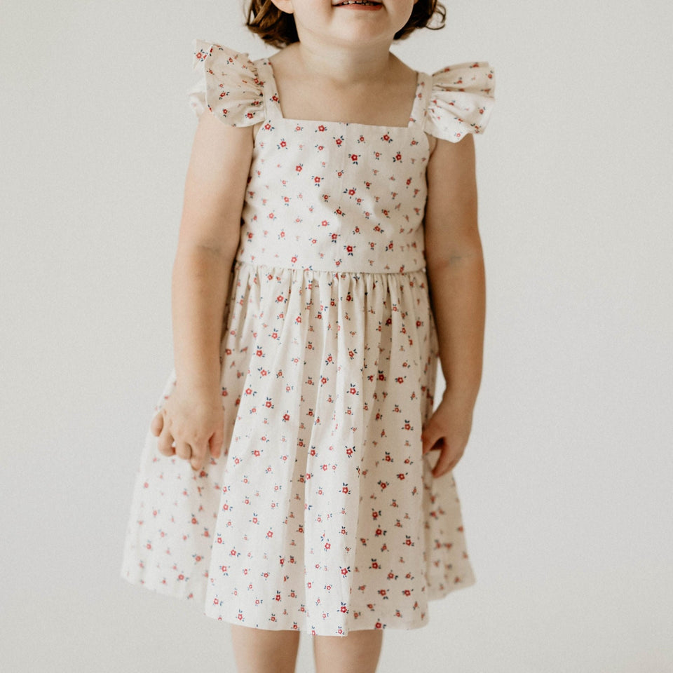 red and white ditsy floral flutter sleeve dress
