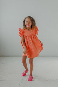 little girl's orange polka dot sun dress