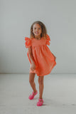 little girl's orange polka dot sun dress