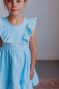 little girls gingham blue pom pom dress