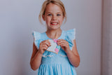 Little Girl's Blue Gingham Pinafore Dress with Pom Pom Trim